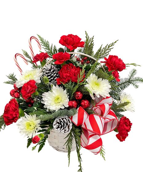 carnation, roses, christmas greens, pine cones, cinnamon, plaid ribbon, wicker basket