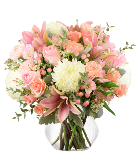 A pink vase arrangement of featuring pink roses, lilies, hypericum berries, chrysanthemums, alstroemeria, carnations, and sweet baby roses