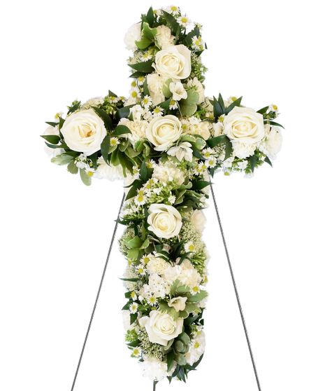 A cross-shaped floral arrangement featuring white roses, daisies, and greenery, displayed on a standing easel.